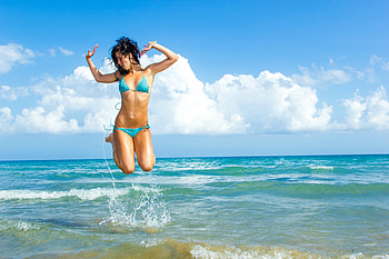 Bikini Model Jumping for Joy, bikini, model, brunette, beach HD wallpaper