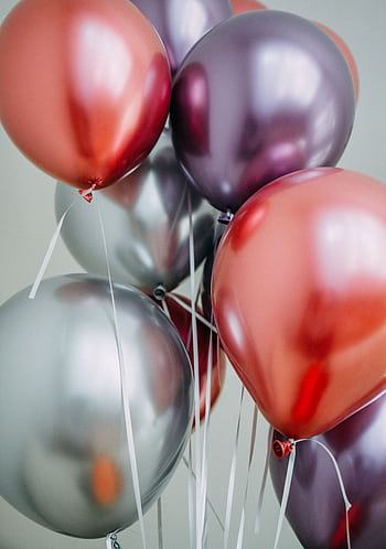 Colorful metallic balloons perfect for festive and party settings. HD phone wallpaper