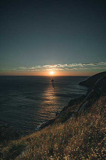Nature, Sunset, Grass, Sea, Sun, Rocks, Slope HD phone wallpaper