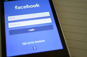 Mobile with Facebook login screen, highlighting digital connectivity and social media use. HD wallpaper