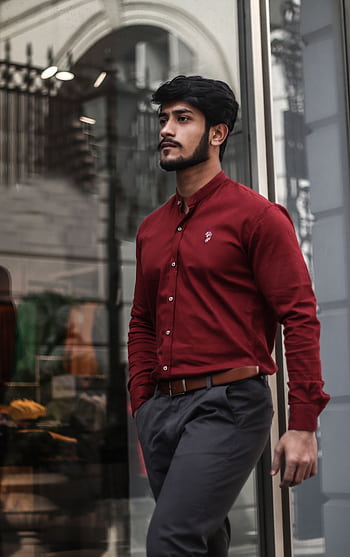 Handsome young man in stylish urban outfit walking confidently on city street hoot outdoors. HD phone wallpaper