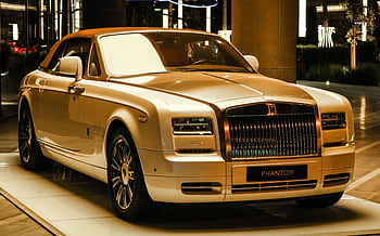 A stunning Rolls Royce Phantom showcased in a luxurious setting in Dubai. HD wallpaper
