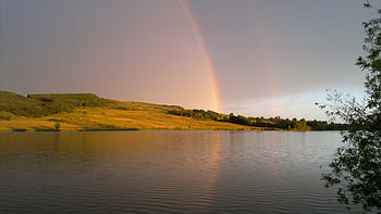 Rainbows over lake, nature, rainbow, rain, lake HD wallpaper