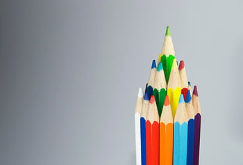 Colorful pencils arranged in a cluster, showcasing creativity and art supplies. HD wallpaper