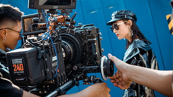 Close-up of a professional video production setup on an outdoor film set. HD wallpaper