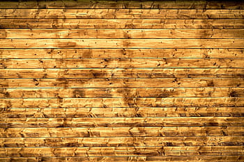 Textured wooden planks forming a rustic wall, perfect for backgrounds or design elements. HD wallpaper