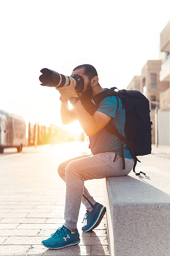 A grapher takes street shots in Rabat, Morocco during the day. HD phone wallpaper