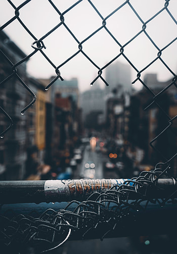 Rain, City, Miscellanea, Miscellaneous, Blur, Smooth, Grid, Fence, Hole HD phone wallpaper