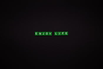 Green letter tiles spelling 'ENJOY LIFE' on a black background, perfect for motivational content. HD wallpaper