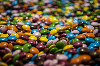 Colorful M&M's, Tempting chocolate, Irresistible candy, Satisfying crunch HD wallpaper
