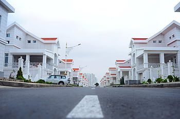 Modern luxury houses line a calm street in Ashgabat, Turkmenistan. HD wallpaper
