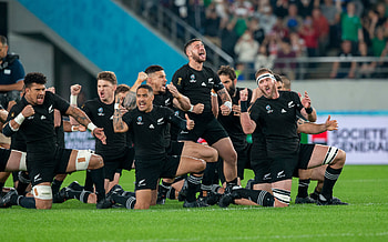 Striped tent atmosphere, Dissolving Black Rugby Haka, Spectator's perspective, Vibrant event HD wallpaper