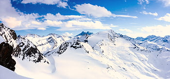Breathtaking panoramic view of the snow-capped mountains in the Austrian Alps during winter. HD wallpaper