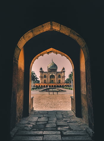 View through an arched hallway towards the historical Safdarjung Tomb in New Delhi, India. HD phone wallpaper