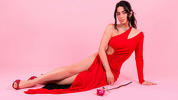 Emeraude Toubia Girl Model Is Wearing Red Dress Sitting In Light Pink Wall Background Girls HD wallpaper