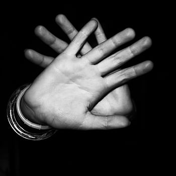 Monochrome close-up of hands in stop gesture against dark background. HD phone wallpaper