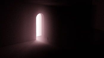 A surreal scene with a lone silhouette in front of an illuminated arched gateway. HD wallpaper