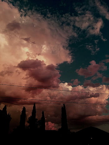 Stunning dramatic sunset clouds over Kingman, Arizona, featuring vibrant colors and silhouetted trees. HD phone wallpaper