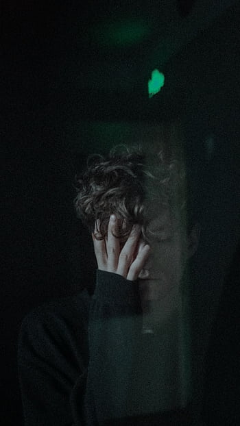 Portrait of a man expressing emotions through a window, conveying a sense of solitude. HD phone wallpaper