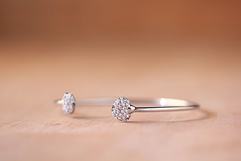 Close-up of a luxurious diamond bracelet showcasing intricate design and elegance. HD wallpaper