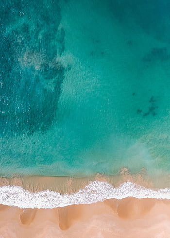 A stunning aerial shot of a beautiful beach in Dambulla, Sri Lanka with clear waters. HD phone wallpaper