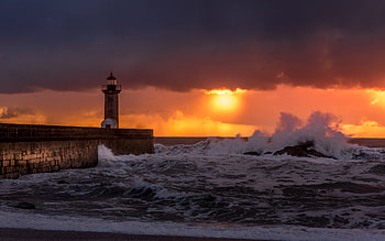 Lighthouse, storm, coast, sunset HD wallpaper