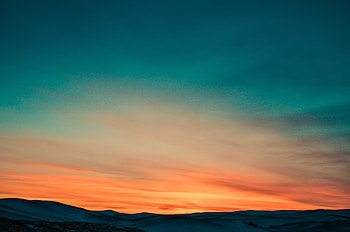 Sunset Over Mountains Covered By Snow , mountains, nature, sunset, snow HD wallpaper