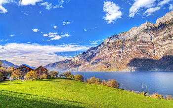 Landscape, blue, river, sunny, colors, peaceful, houses, beauty, trees, mountains, water, breathtaking, architecture, house, beautiful, grass, field, green, view, clouds, nature, sky, cottage, lovely HD wallpaper