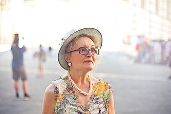 Elegant senior woman in Florence, Italy, enjoying a sunny day. HD wallpaper