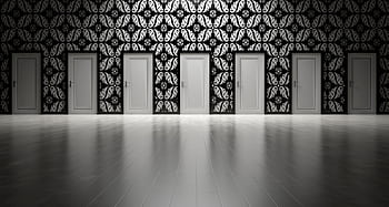 Five closed doors in a black and white ornate hallway symbolizing opportunities and decisions. HD wallpaper