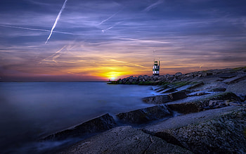 Lighthouse, water, beach, sunset HD wallpaper