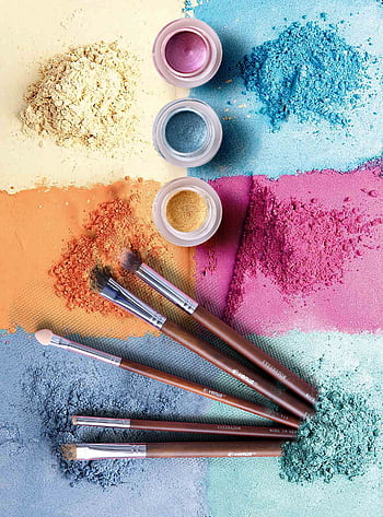 Colorful makeup powders and brushes in an artistic flat lay composition. HD phone wallpaper