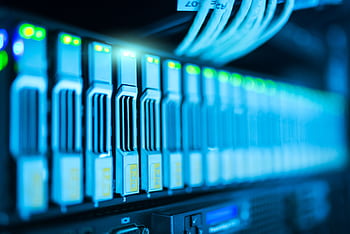 Detailed of a server rack with glowing lights in a modern data center. HD wallpaper