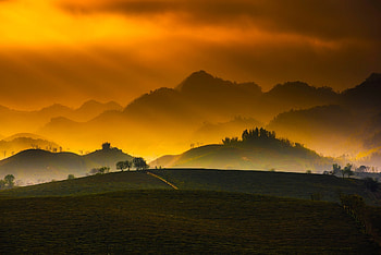 Sunset over the country, mist, fog, sunsets, nature, mountains, orange, haze HD wallpaper
