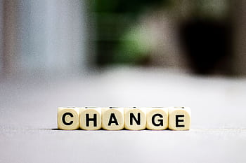 Close-up of letter blocks spelling 'CHANGE', symbolizing transformation and growth. HD wallpaper