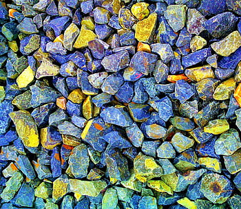 Vibrant blue and yellow gravel stones creating a textured pattern in Bhagalpur, India. HD wallpaper