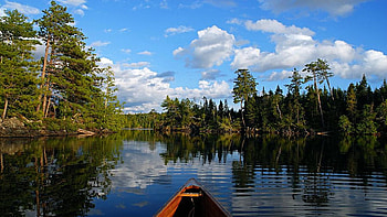 In a canoe on quiet Spoon Lake, boat, Montana, clouds, trees, USA, sky, water, reflections HD wallpaper