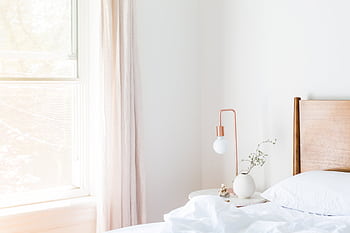 Bright minimalist bedroom with modern furniture and natural lighting. HD wallpaper