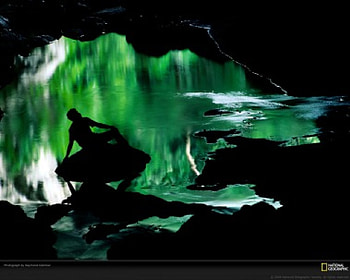 green pool, man in cave entrence HD wallpaper