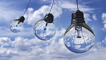 Surreal of light bulbs reflecting blue sky and clouds, symbolizing creativity and energy. HD wallpaper