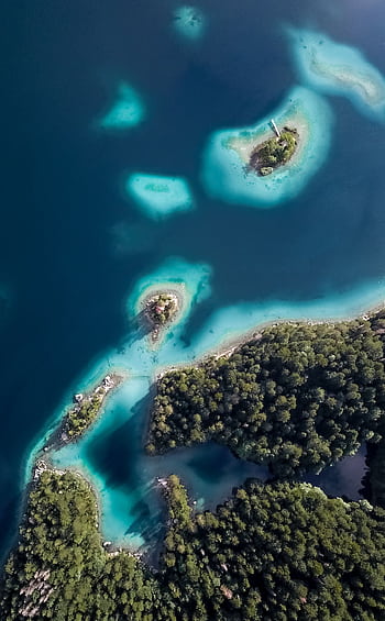Stunning aerial view of turquoise waters and lush islands in Grainau, Germany. HD phone wallpaper