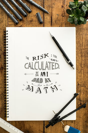 Flat lay of hand lettering on sketchbook with art tools on wooden desk HD phone wallpaper