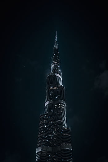 Dramatic nighttime of the iconic Burj Khalifa in Dubai's night sky. HD phone wallpaper