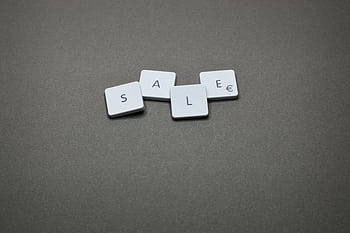 Close-up of tiles spelling 'SALE' showcasing a minimalist design theme. HD wallpaper