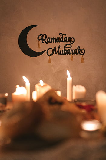 A serene Ramadan Mubarak decoration with glowing candles, perfect for festive ambiance. HD phone wallpaper