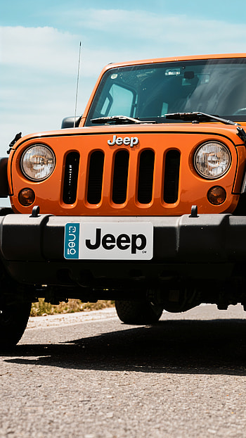 Bold Jeep Front View – Perfect for Adventure Fans, SUV, vehicle, car, orange (Color) HD phone wallpaper