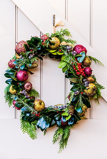 Bright and colorful Christmas wreath with ornaments, perfect for holiday decoration. HD phone wallpaper