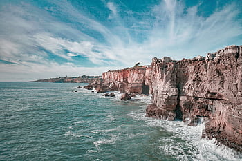 Beautiful seascape featuring cliffs and the Atlantic Ocean along Portugal's que coastline. HD wallpaper