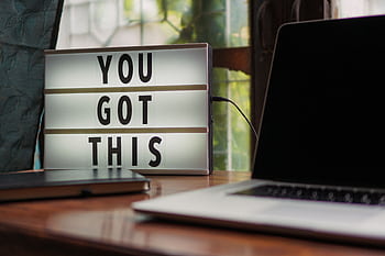 Lit sign with 'You Got This' alongside laptop on office desk. HD wallpaper