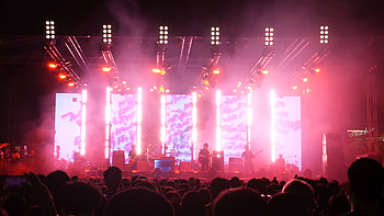 Concert crowd, Blurred stage lights, Dynamic movement, Rock n roll energy HD wallpaper
